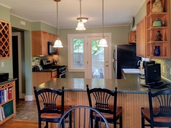 62 Edgehill Road Winthrop, MA 02152 - Photo 9 of 29 a view of a dining room with furniture window and wooden floor