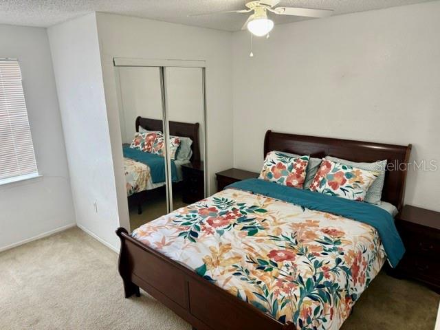 3705 Southwest 27th Street, Unit 1112 Gainesville, FL 32608 - Photo 13 of 23 a bedroom with a bed and a dresser