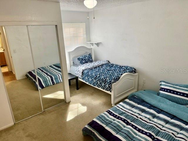 3705 Southwest 27th Street, Unit 1112 Gainesville, FL 32608 - Photo 16 of 23 a bedroom with furniture and a window