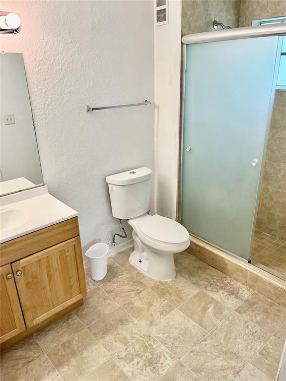3705 Southwest 27th Street, Unit 1112 Gainesville, FL 32608 - Photo 17 of 23 a white toilet sitting next to a sink