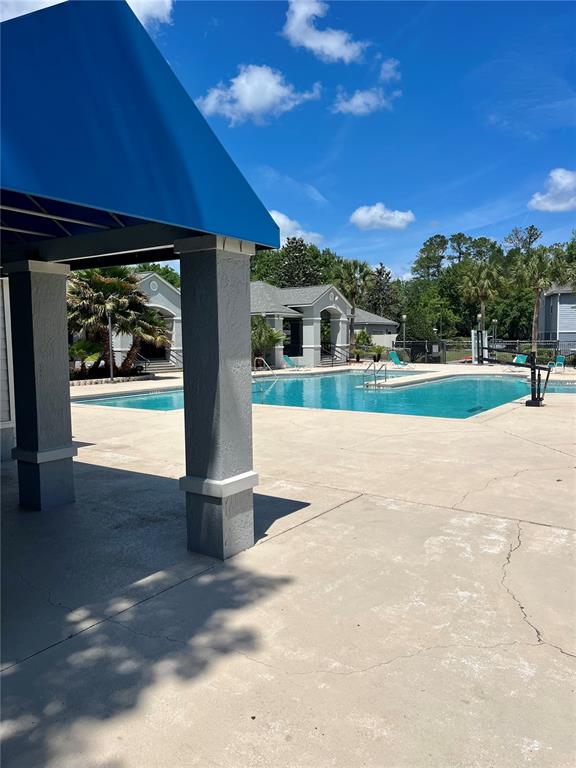 3705 Southwest 27th Street, Unit 1112 Gainesville, FL 32608 - Photo 2 of 23 a view of a house with a yard