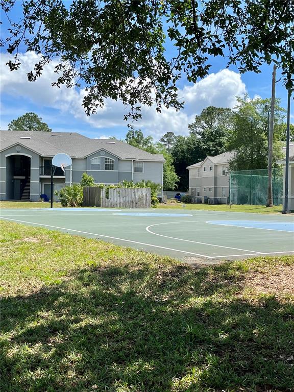 3705 Southwest 27th Street, Unit 1112 Gainesville, FL 32608 - Photo 22 of 23 a view of a house with a yard