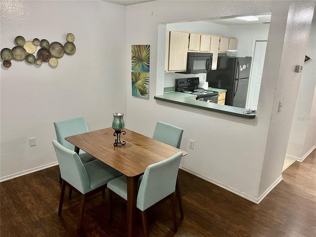3705 Southwest 27th Street, Unit 1112 Gainesville, FL 32608 - Photo 7 of 23 a view of kitchen with sink and wooden floor