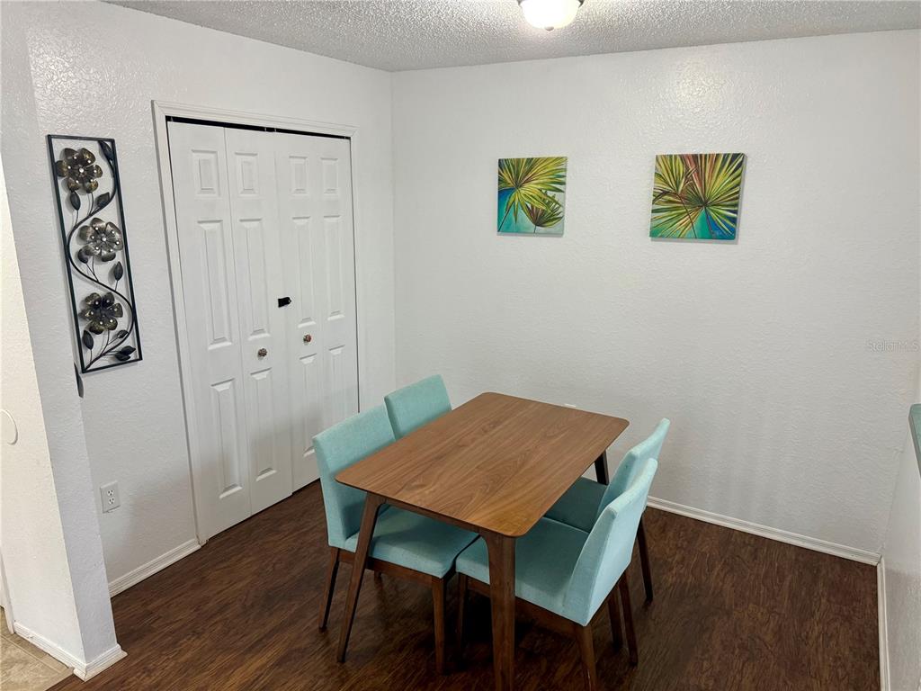 3705 Southwest 27th Street, Unit 1112 Gainesville, FL 32608 - Photo 8 of 23 a view of a workspace with furniture and wooden floor