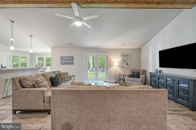 a kitchen with refrigerator a stove a sink and cabinets
