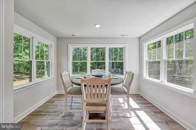 a bathroom with a double vanity sink mirror and toilet