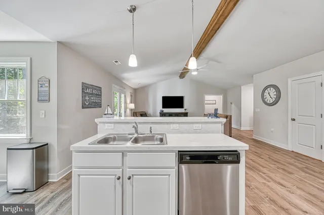a living room with furniture and baby crib