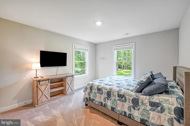 a bedroom with a bed and a cabinets