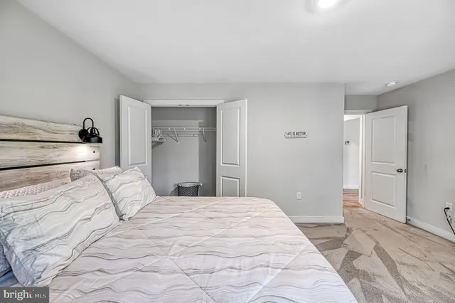 an aerial view of residential house with outdoor space and trees all around