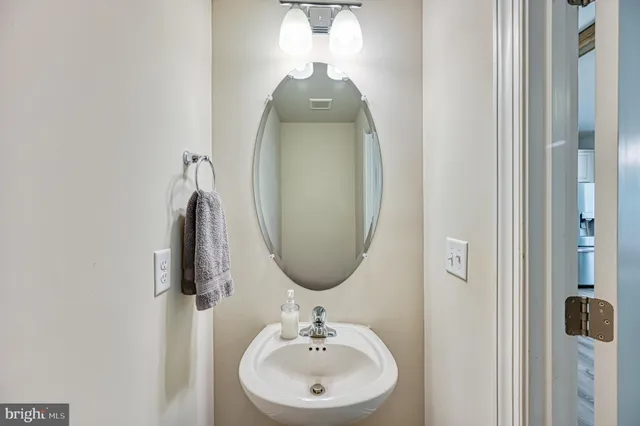 an aerial view of a house with a yard and lake view