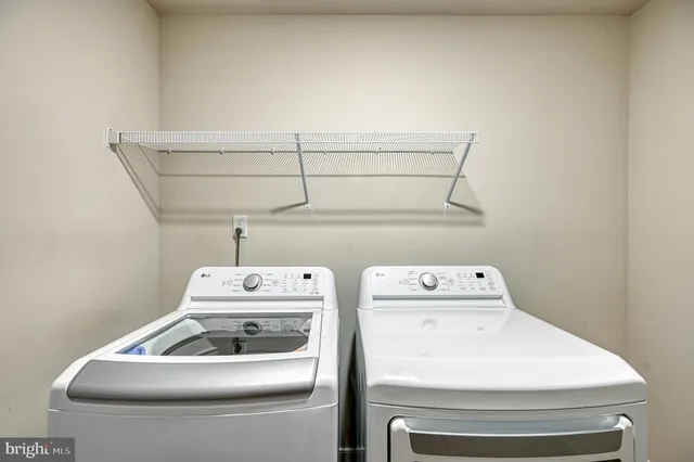 an aerial view of a house with a yard and lake view