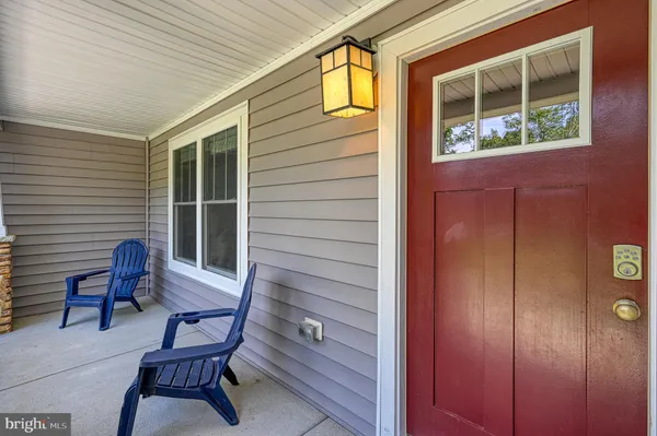 a view of a house with a chairs in patio
