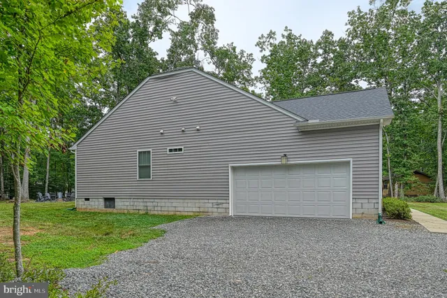 a front view of house with backyard