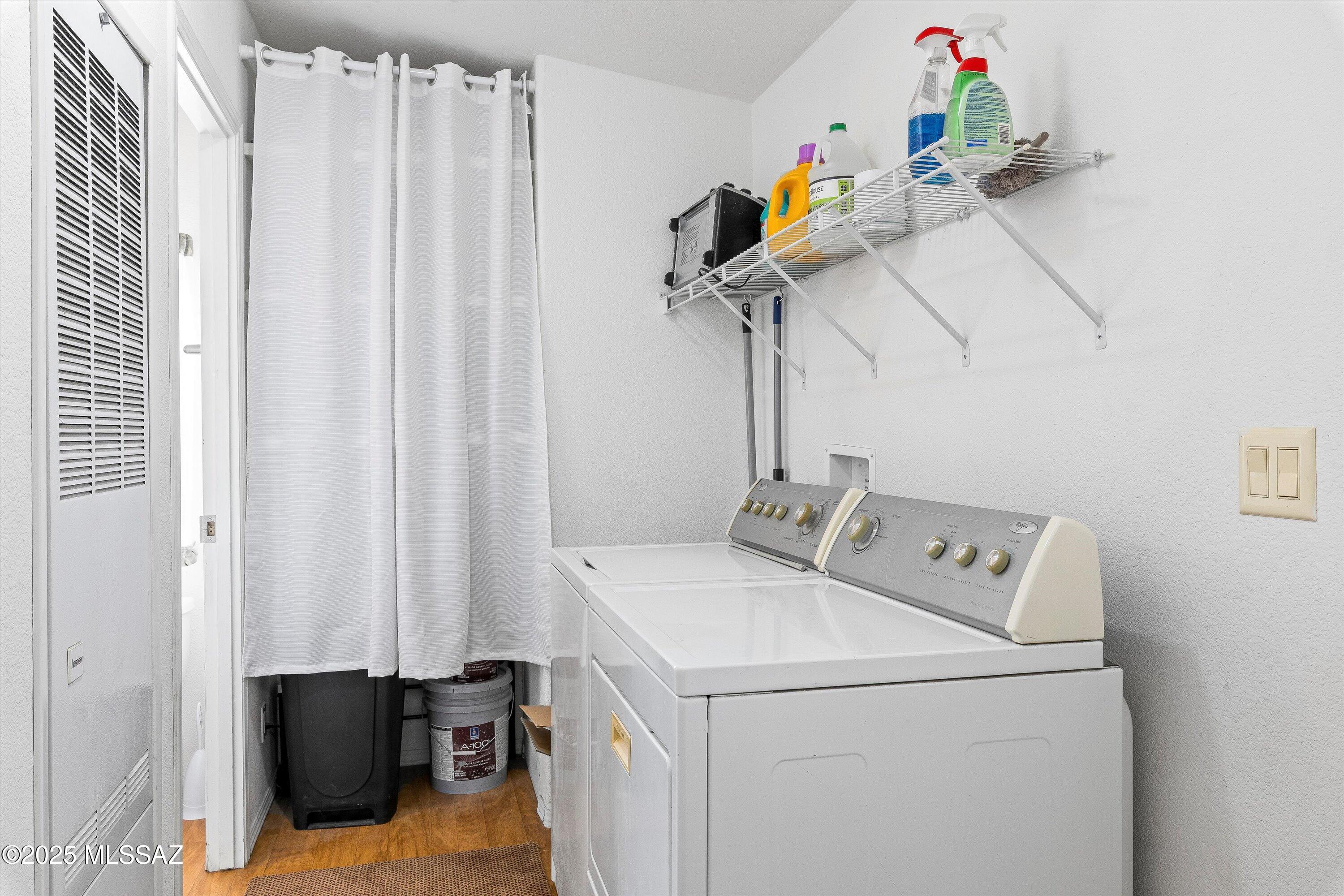 12055 North Musket Road Marana, AZ 85653 - Photo 14 of 17 Laundry room with storage and access to master bedroom and back yard.