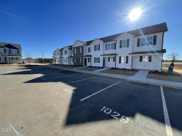 a front view of a building with street view
