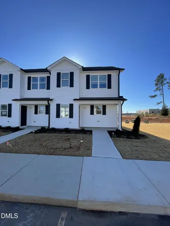 a front view of a house with yard