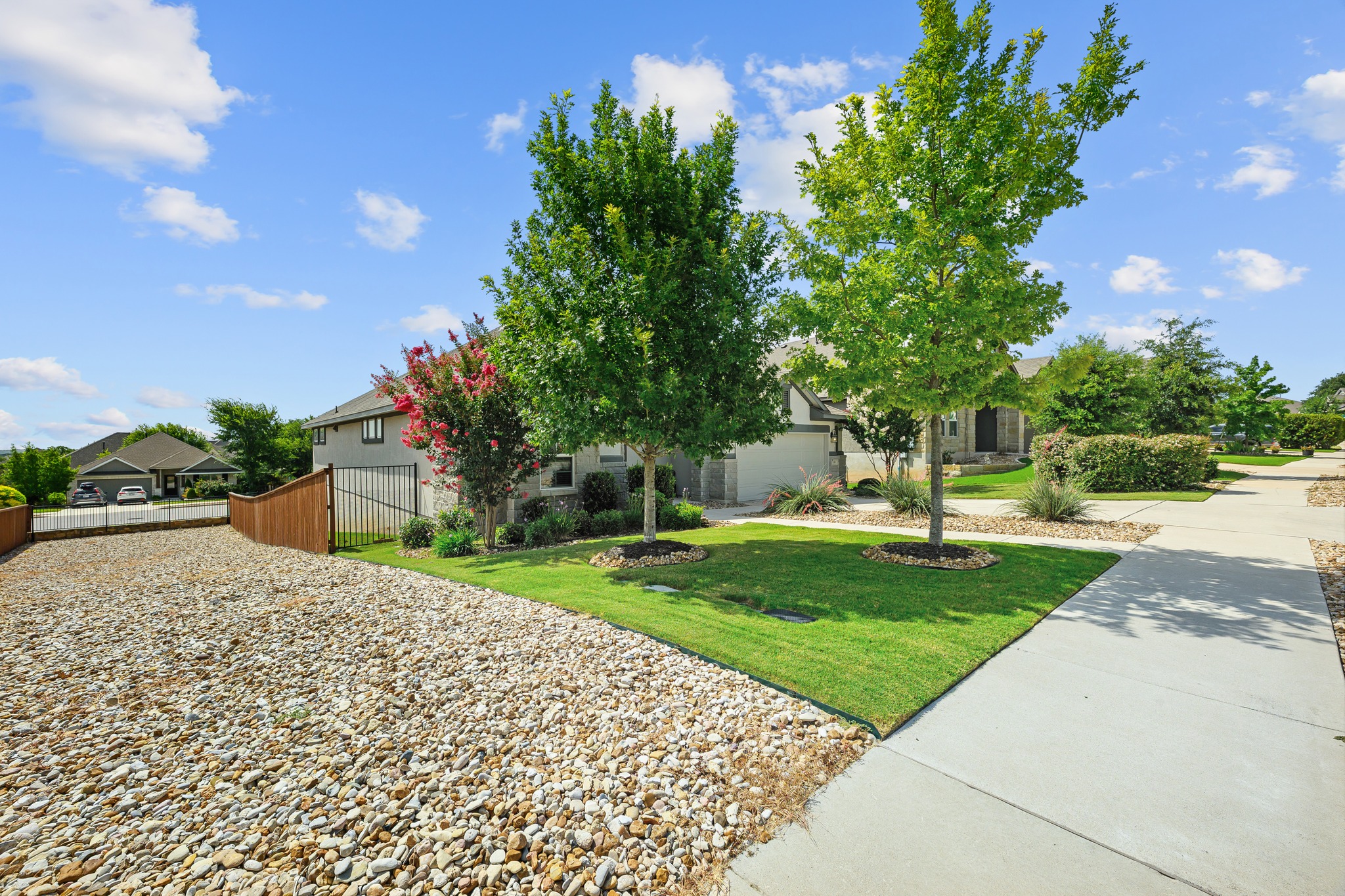 68 Rancho Trail Georgetown, TX 78628 - Photo 26 of 39 A well-maintained lawn and mature trees enhance the inviting curb appeal of this home.