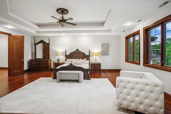 a spacious bedroom with a bed and a couch