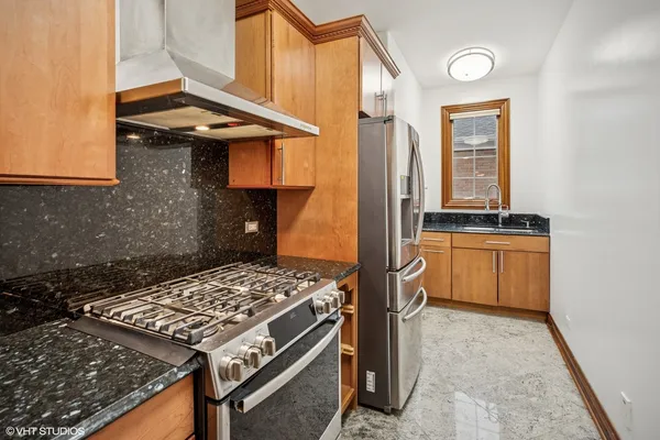 a kitchen that has a stove and a microwave