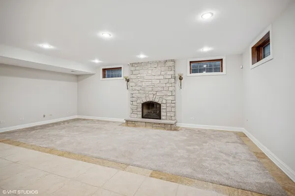 a view of an empty room with a fireplace