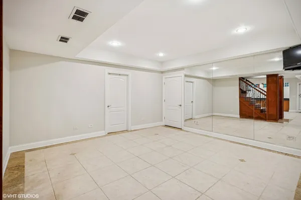 a bathroom with a toilet a sink and a mirror