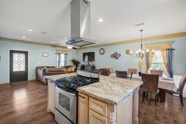 a kitchen with stainless steel appliances granite countertop a stove and a sink