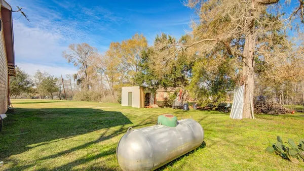 a swimming pool with trees in the background
