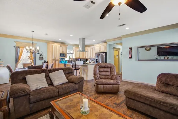 a kitchen with stainless steel appliances granite countertop a sink stove and cabinets