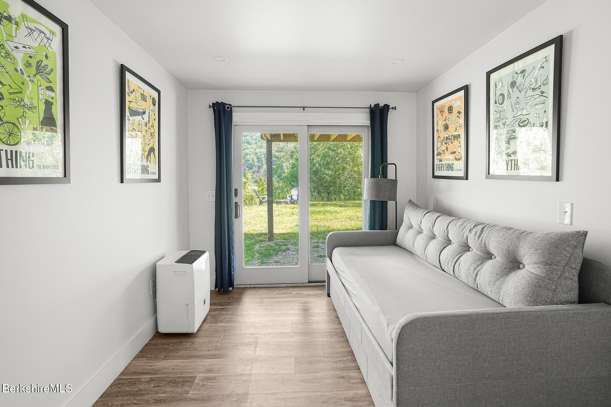 140 Beaver Dam Road Lee, MA 01238 - Photo 16 of 29 a living room with furniture and a large window