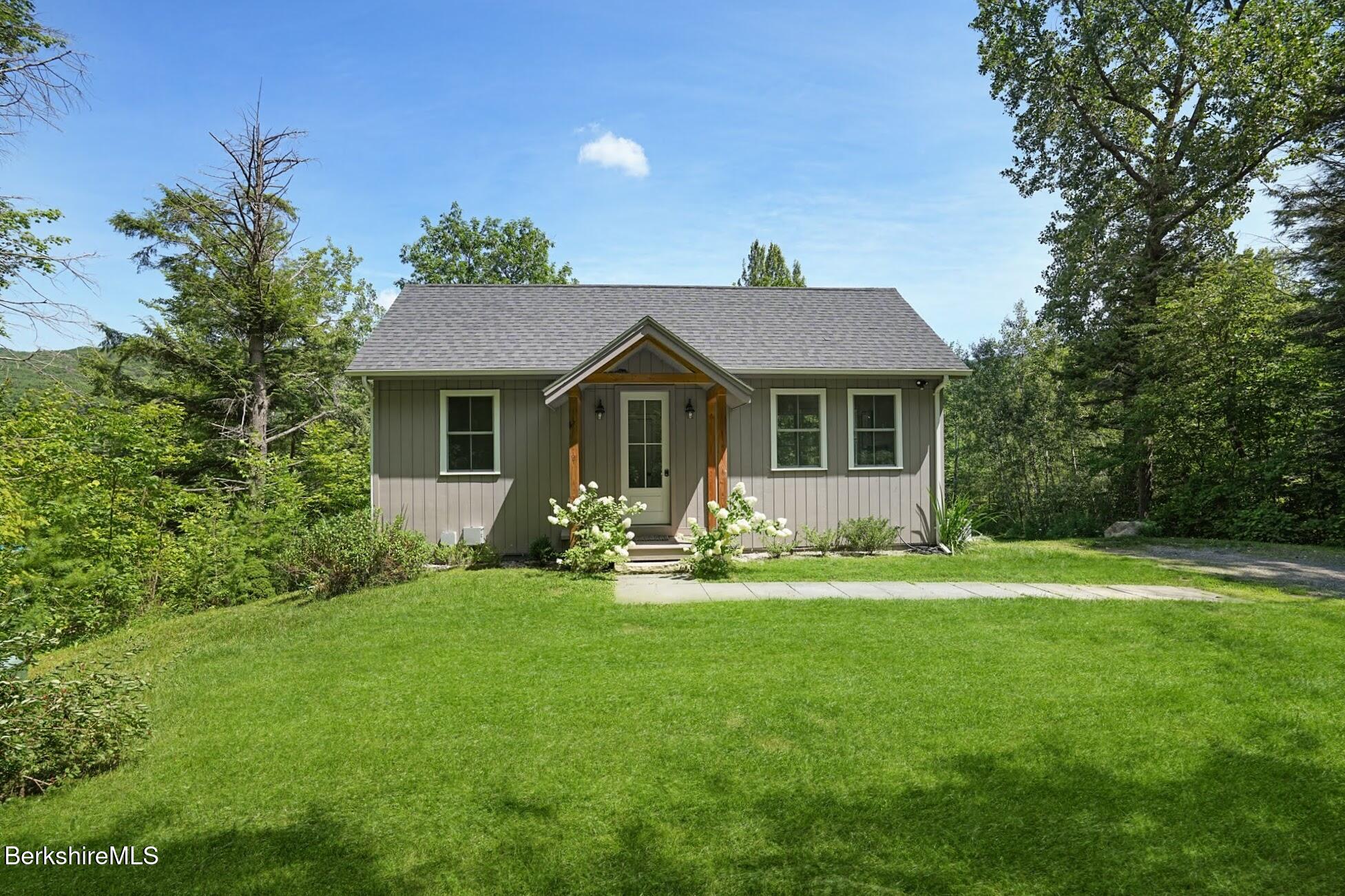 140 Beaver Dam Road Lee, MA 01238 - Photo 2 of 29 a front view of a house with a yard