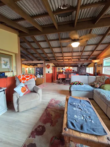 a view of a living room and kitchen