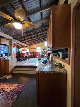 a view of a living room and kitchen
