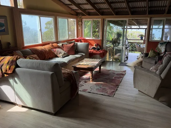 a bedroom with furniture and a window