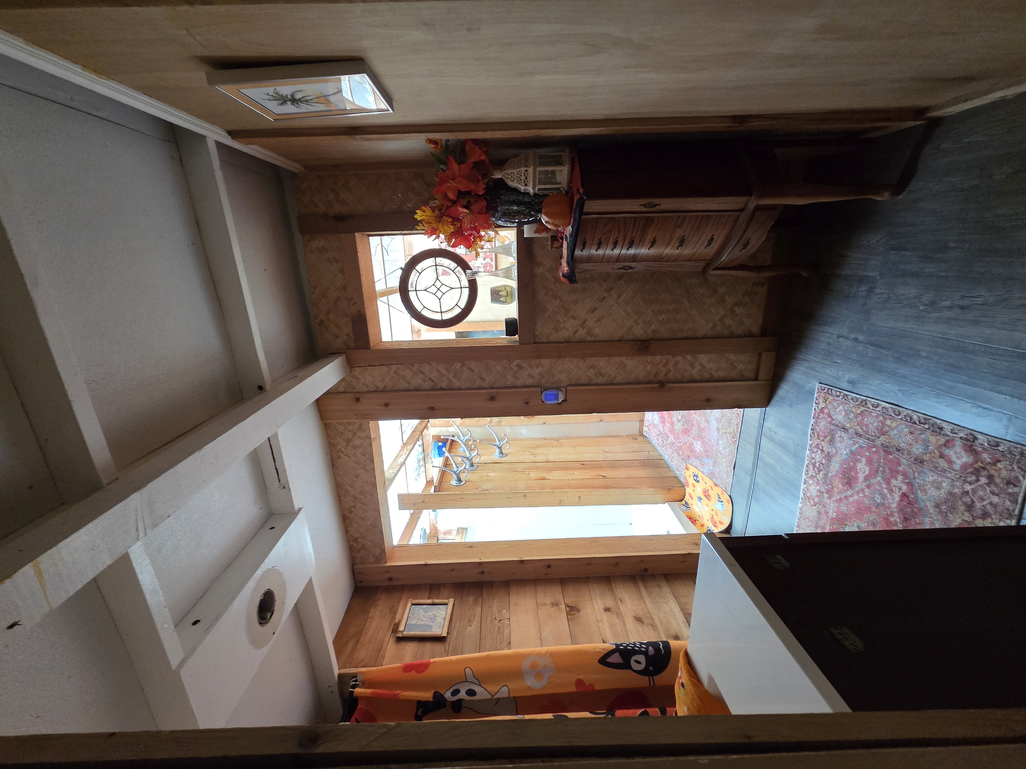 83-5782 Napoopoo Road Captain Cook, HI 96704 - Photo 18 of 30 a view of entryway with a grandfather clock and wooden floor