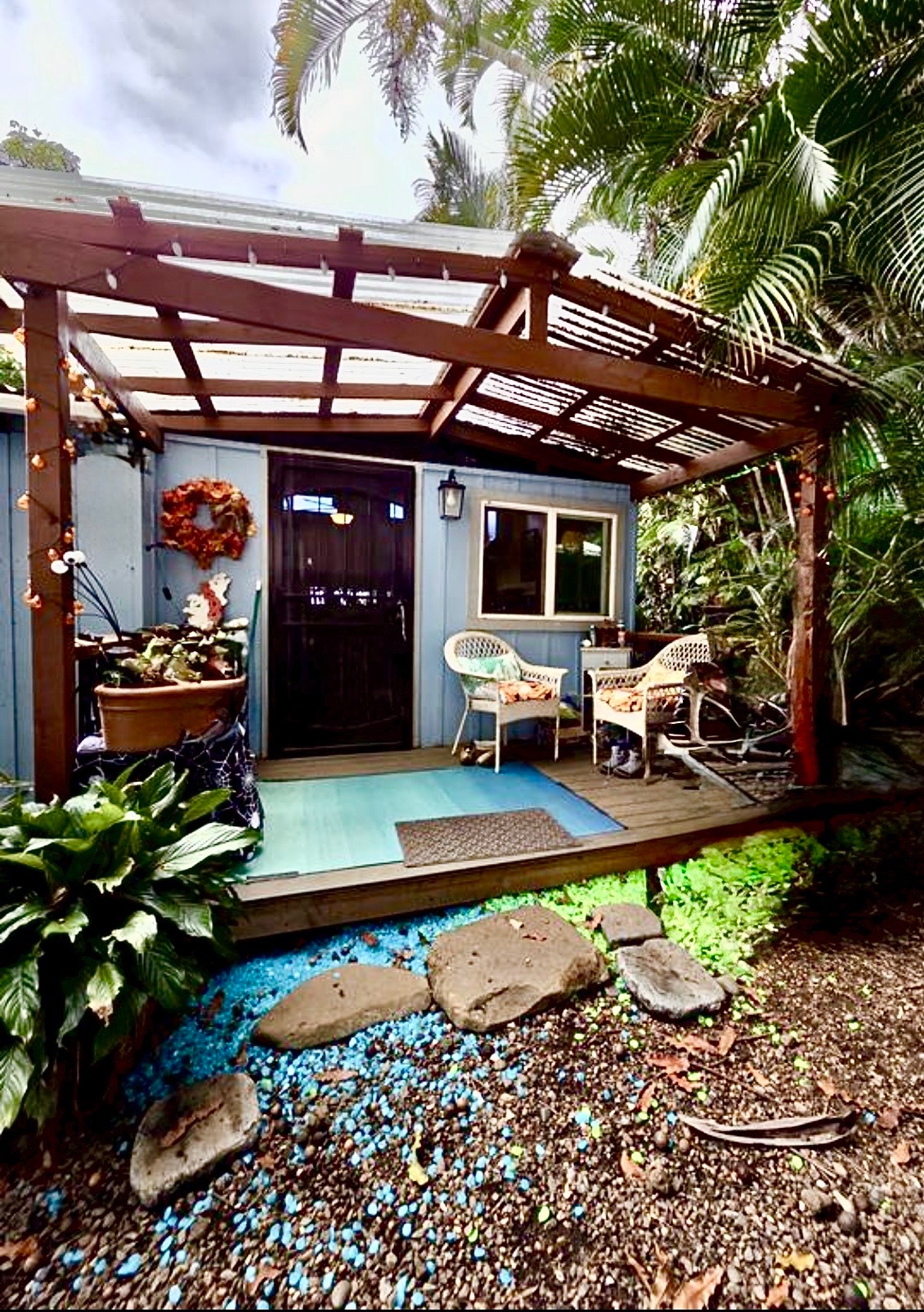 83-5782 Napoopoo Road Captain Cook, HI 96704 - Photo 2 of 30 a view of a chairs and table in a patio