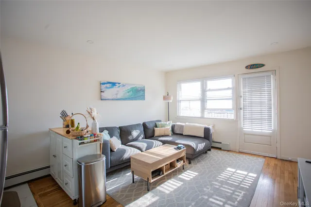 a kitchen with a refrigerator and a stove top oven