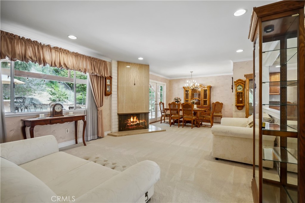 11300 Dulcet Avenue Porter Ranch, CA 91326 - Photo 11 of 55 a living room with furniture and a fireplace