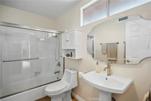 a view of a swimming pool with lounge chairs