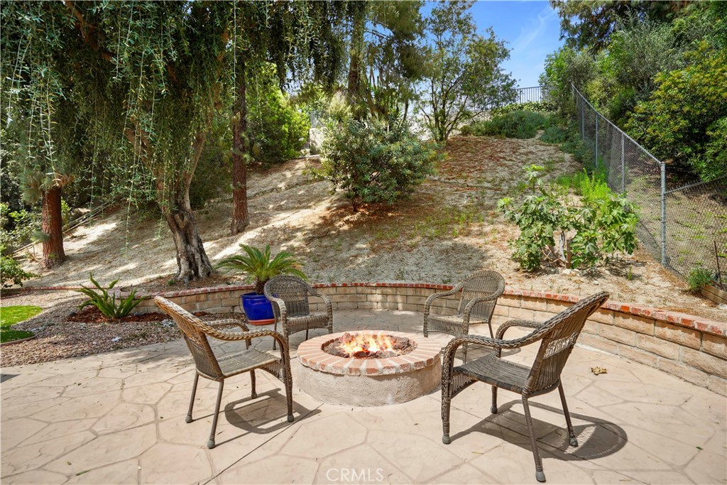 11300 Dulcet Avenue Porter Ranch, CA 91326 - Photo 50 of 55 a backyard of a house with table and chairs