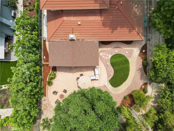 an aerial view of a house with a garden