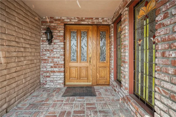 a spacious bedroom with a large bed and a couch