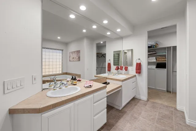 a kitchen that has a sink and a refrigerator