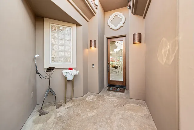 a view of a hallway with paintings on the wall