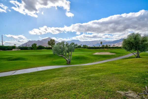 a view of a golf course with a lake