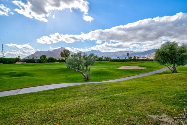 a view of a golf course with a lake
