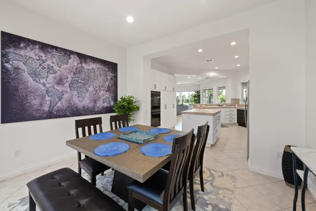 a dining room with furniture and window