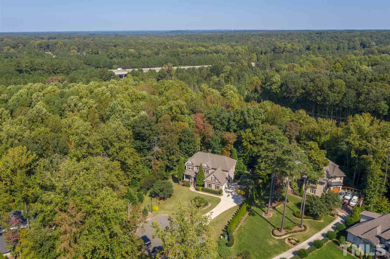 9020 Albatross Court Raleigh, NC 27613 - Photo 3 of 28 an aerial view of residential house with outdoor space and trees all around