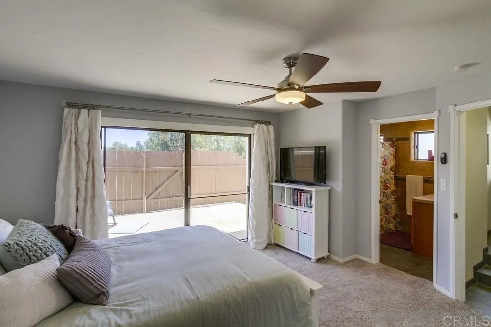 1582 Sunrise Drive Vista, CA 92084 - Photo 15 of 17 a bedroom with a bed and a flat screen tv