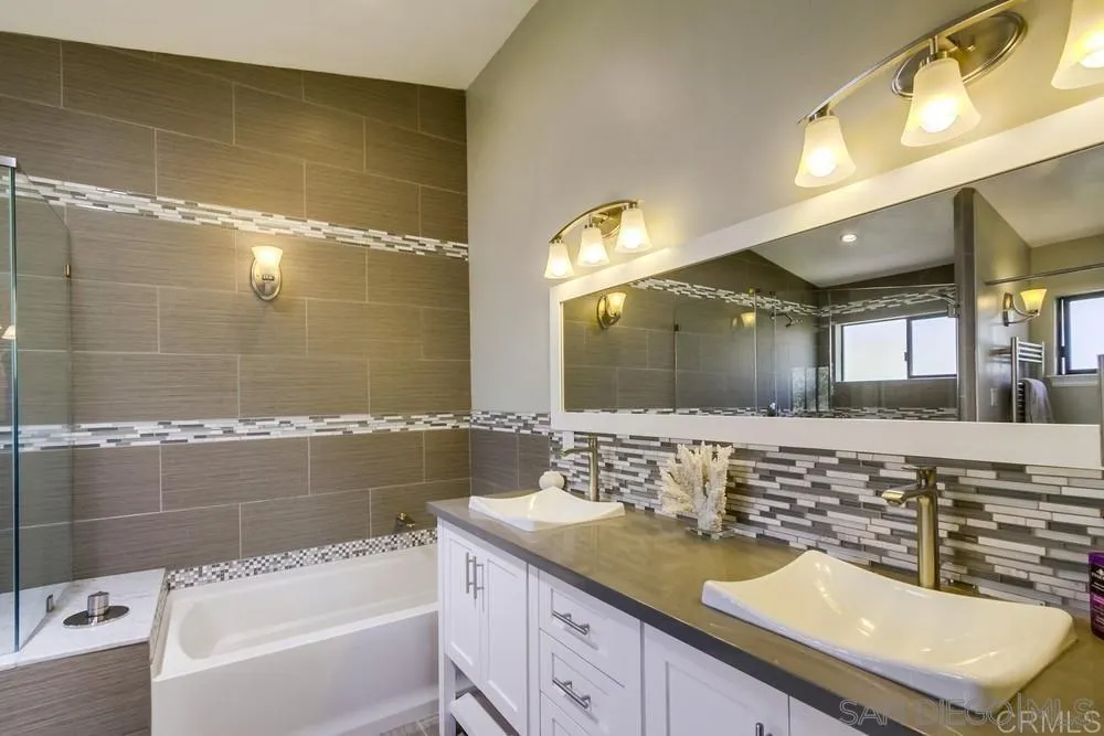 1582 Sunrise Drive Vista, CA 92084 - Photo 16 of 17 a bathroom with a granite countertop sink mirror and bathtub