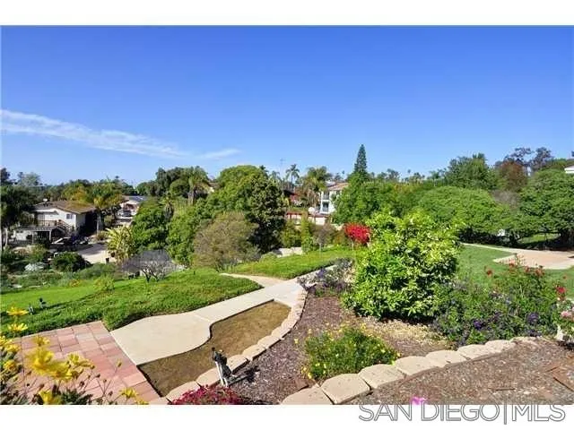 1582 Sunrise Drive Vista, CA 92084 - Photo 3 of 17 a view of a bench in a garden